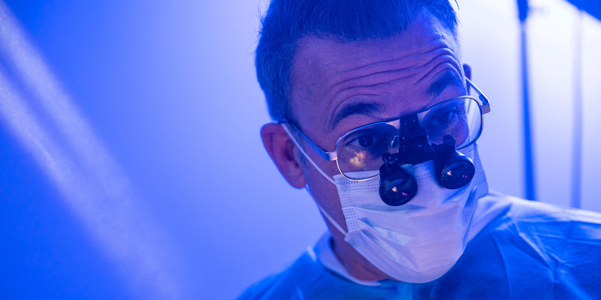 Dr. Muir in surgical masking close-up